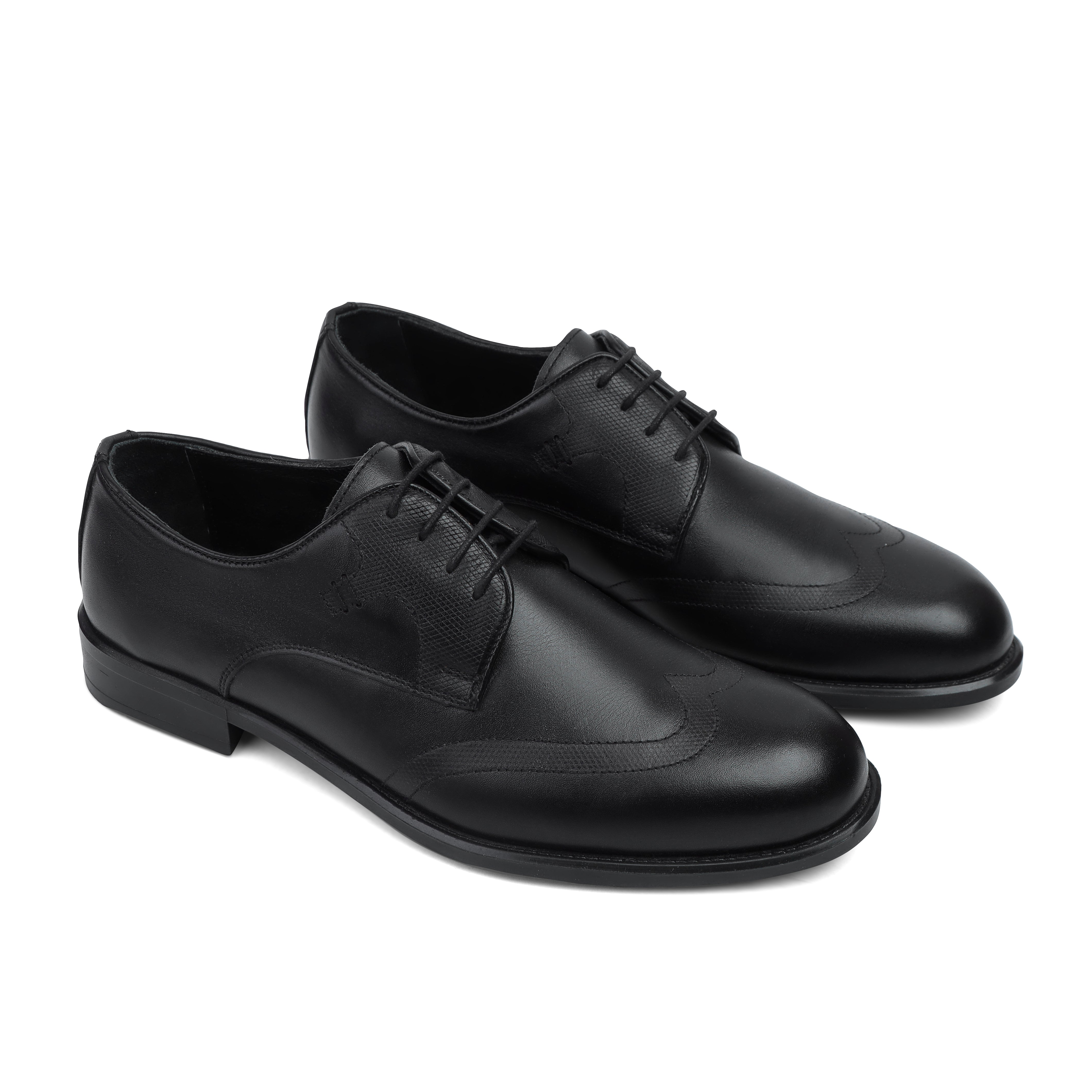 Image of Pair of black leather dress shoes on a white background