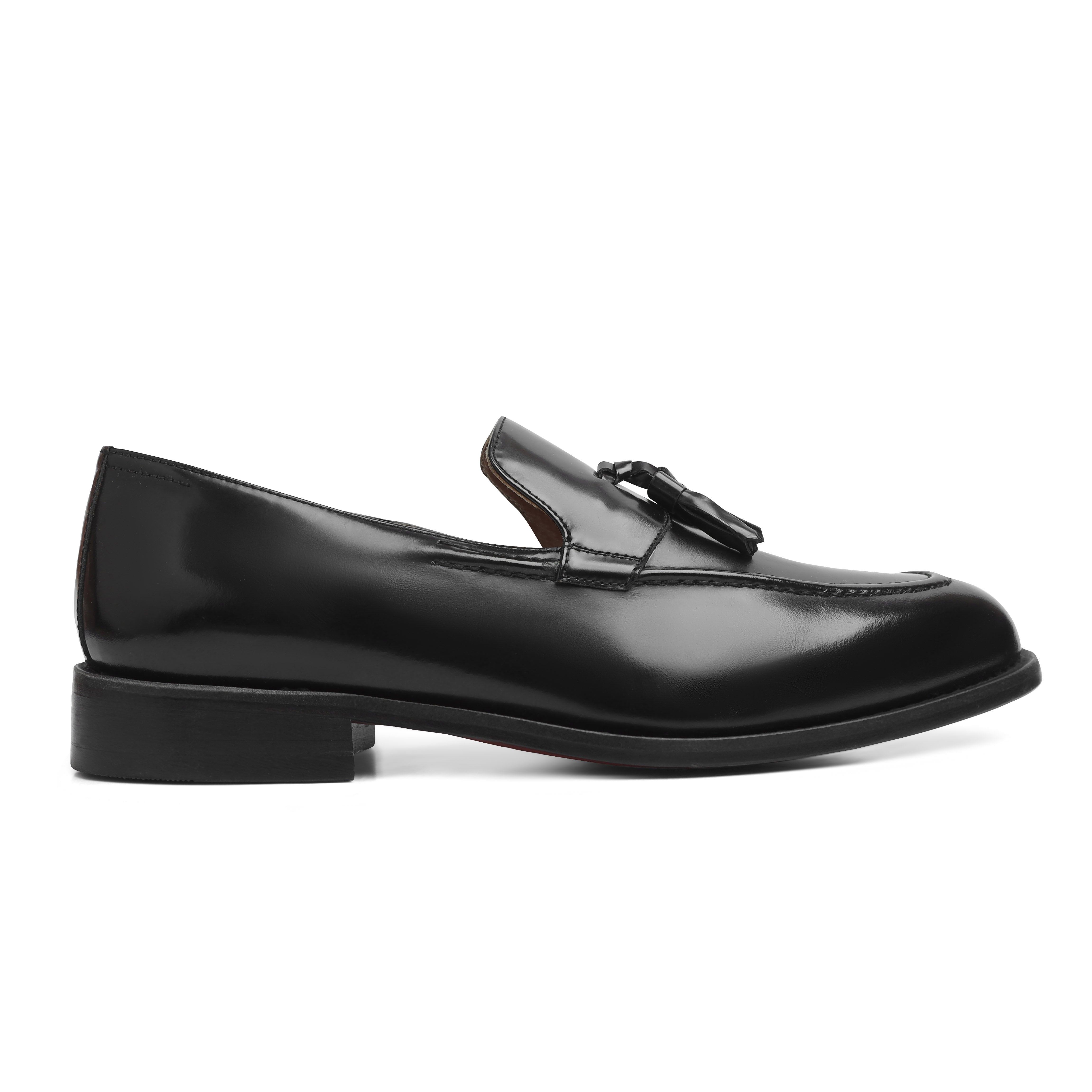 Image of Black loafer shoe with a tassel on a white background