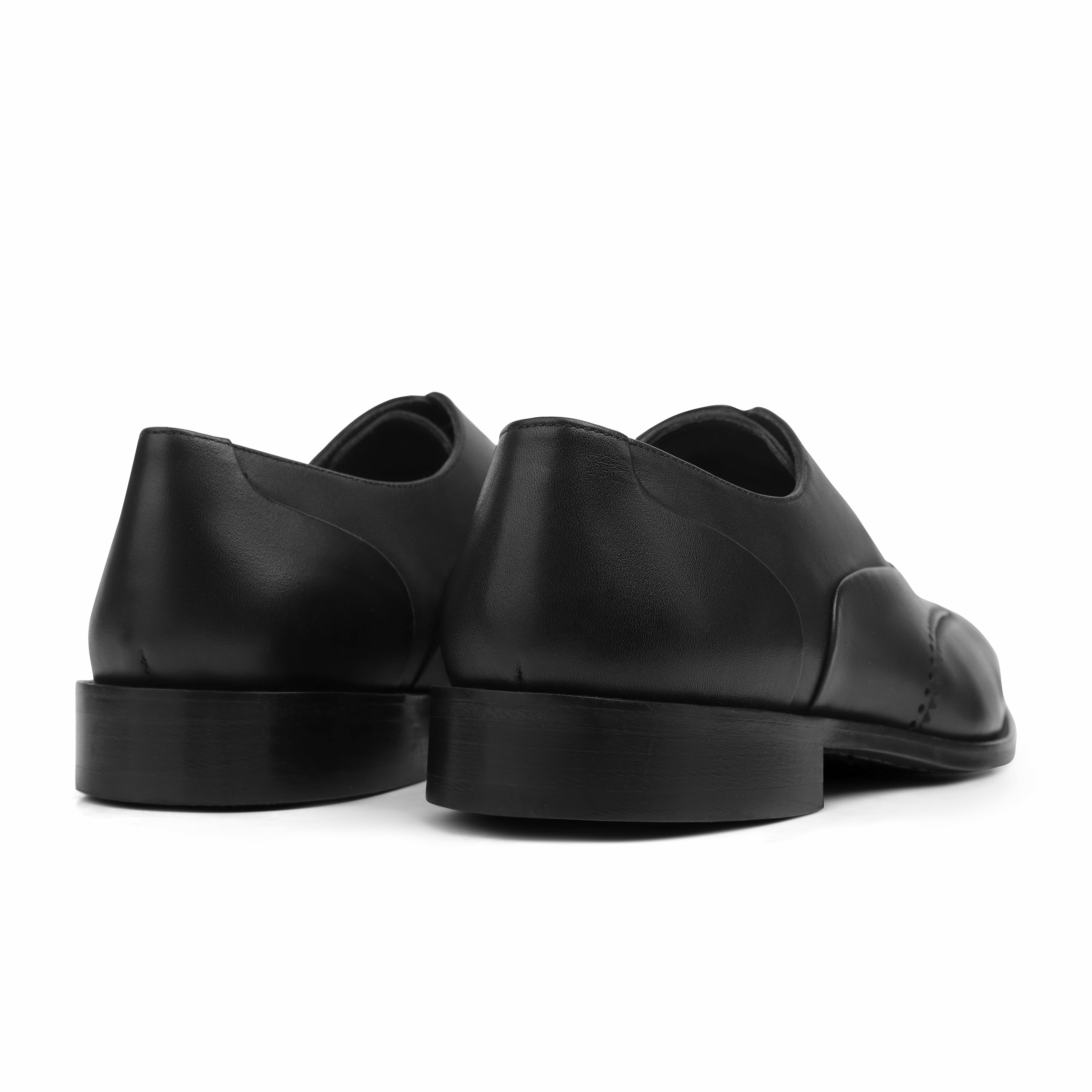 Image of Black leather shoes on a white background