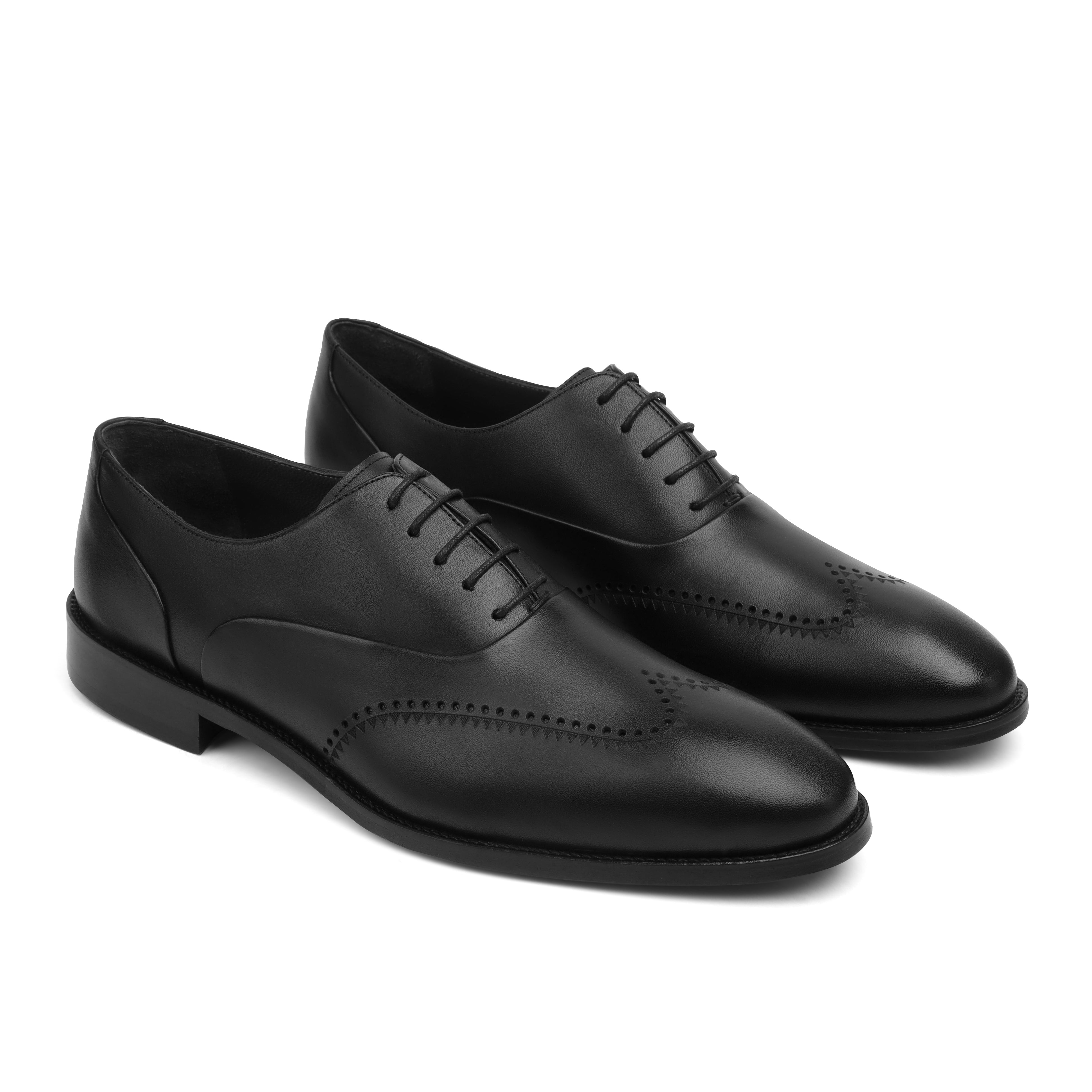 Image of Pair of black leather dress shoes on a white background
