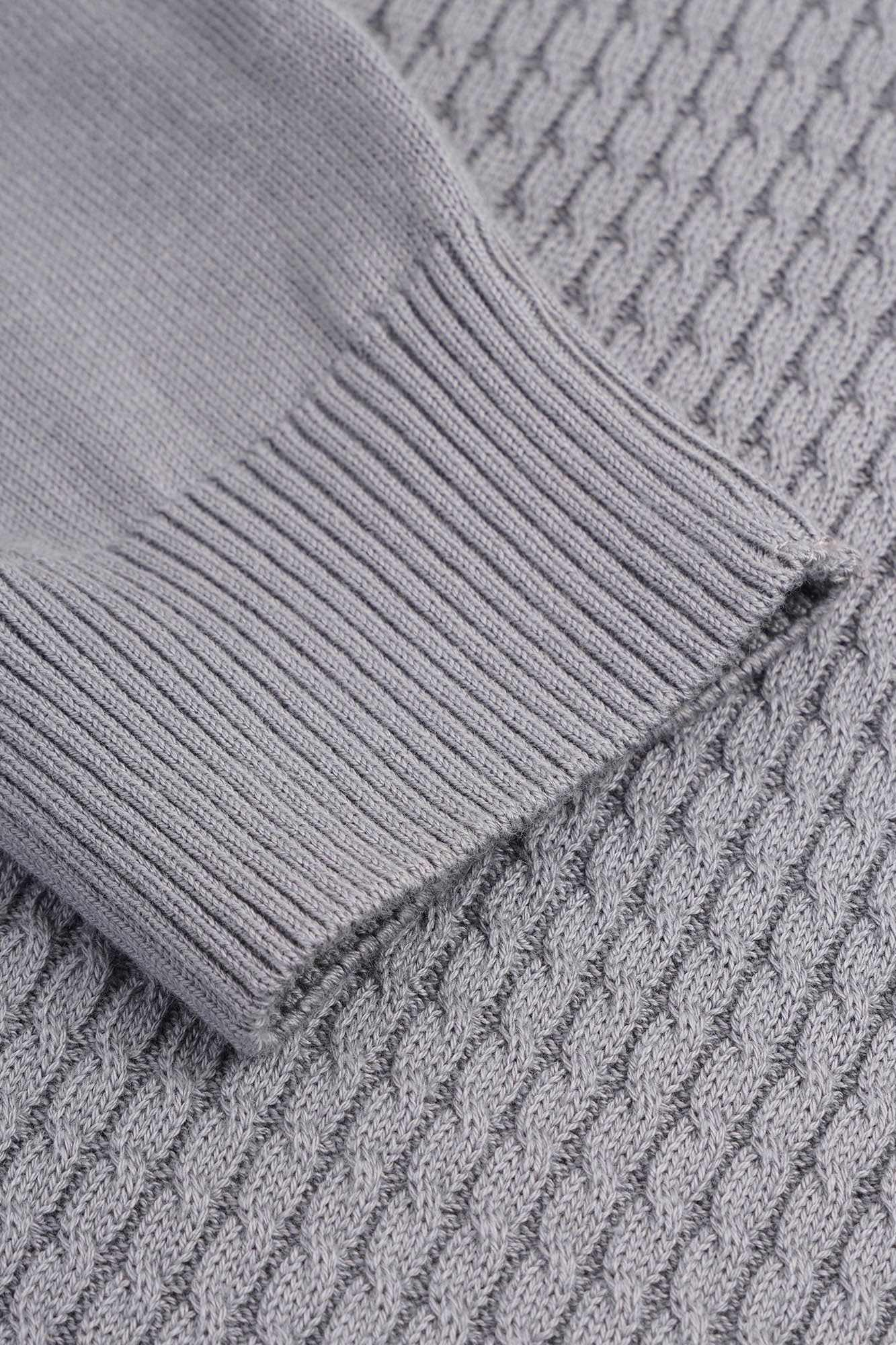 Image of Close-up of a textured gray fabric with a focus on the pattern and texture.