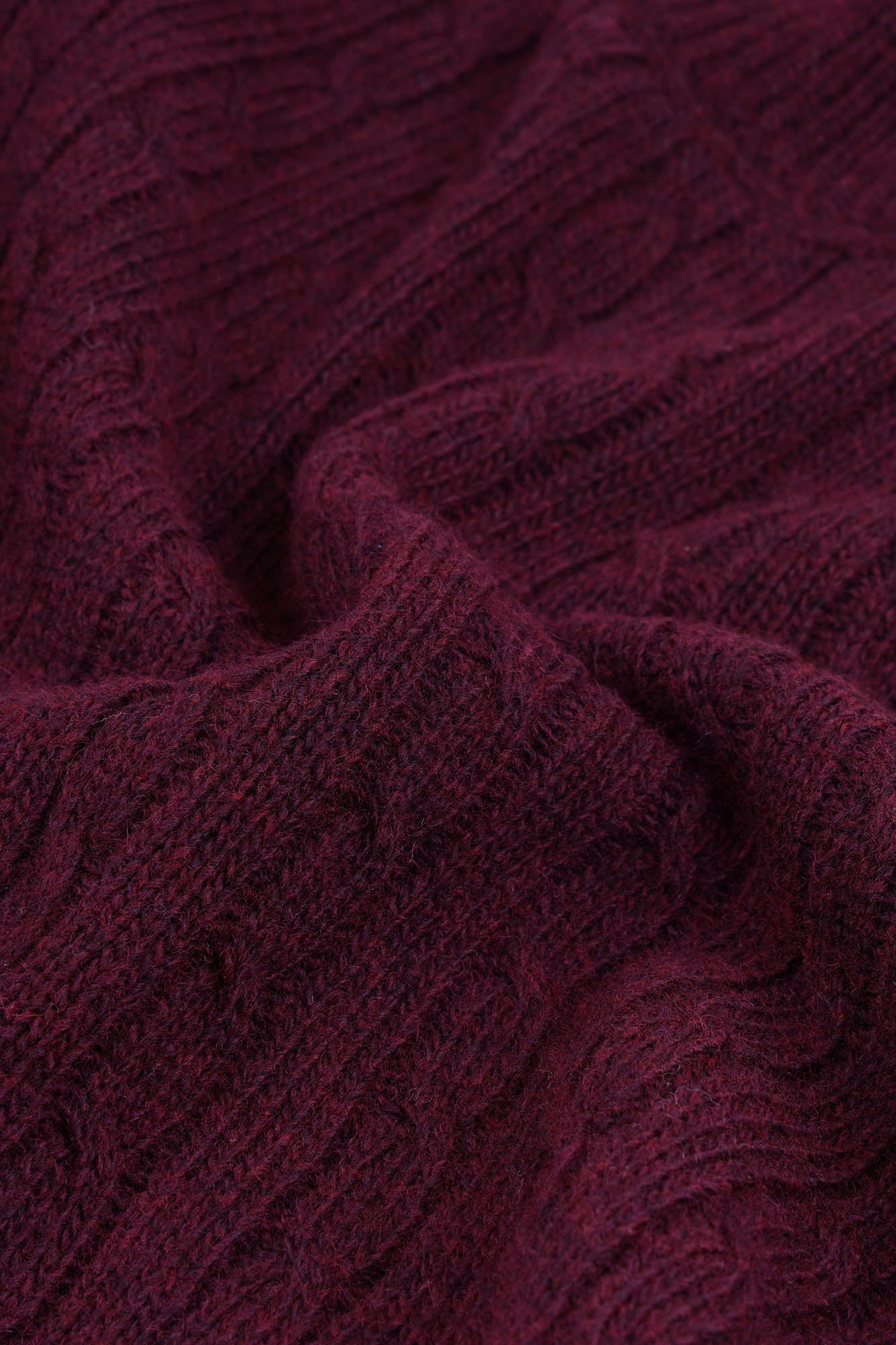 Image of Close-up of a textured burgundy fabric