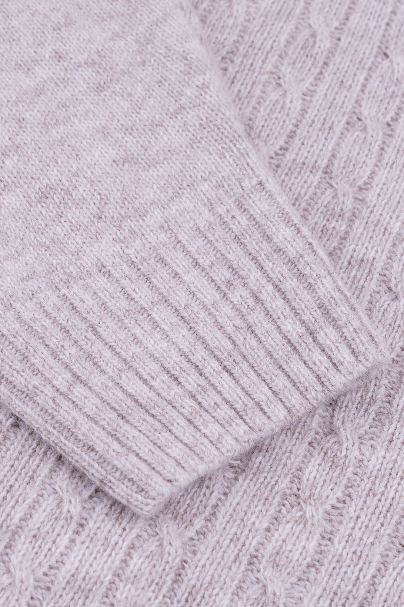 Image of Close-up of a textured gray fabric with a subtle pattern