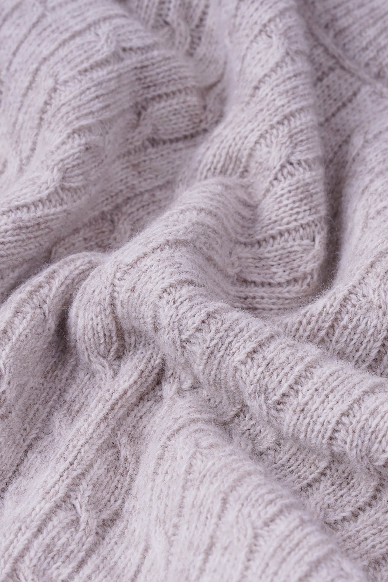 Image of Close-up of a textured gray fabric with intricate patterns