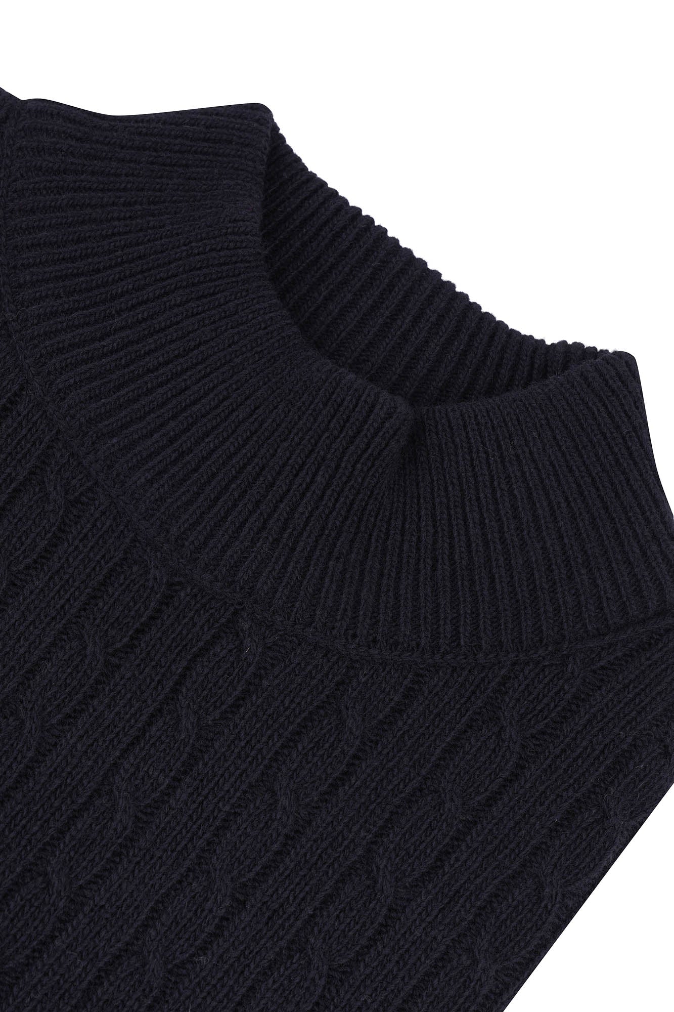 Image of Close-up of a black knitted sweater on a white background