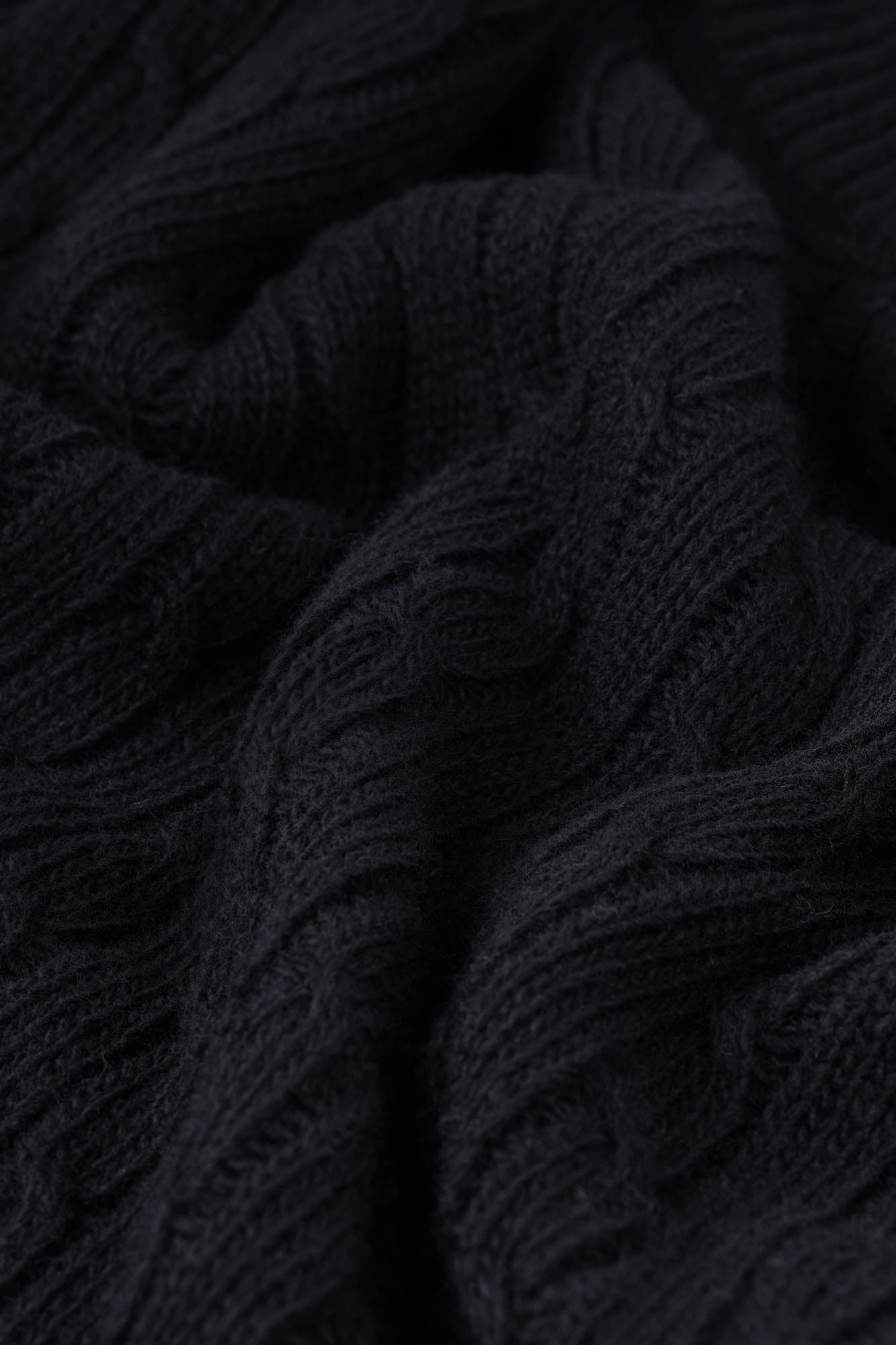 Image of Close-up of dark textured fabric