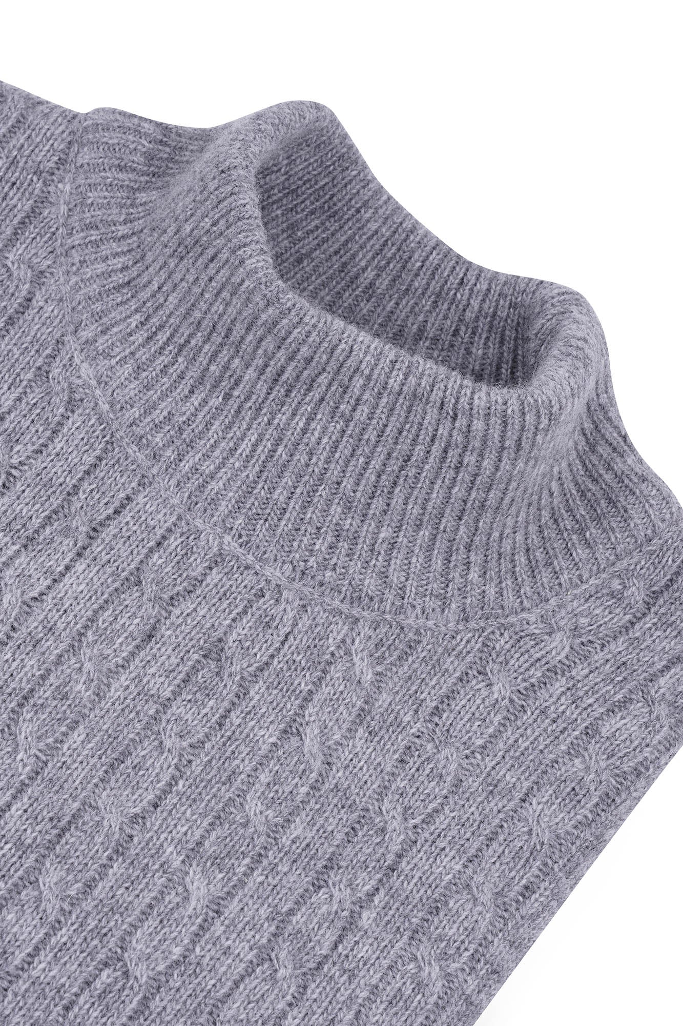 Image of Close-up of a gray knitted sweater on a white background