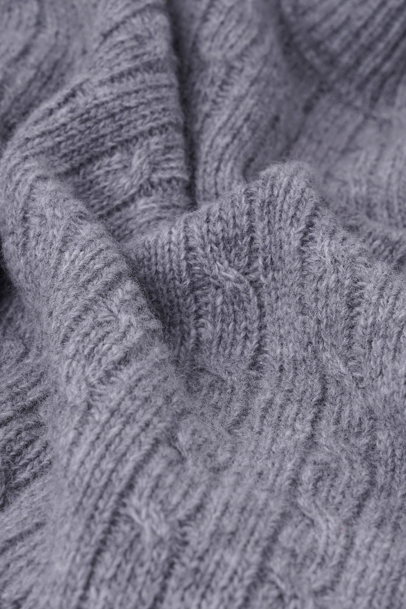 Image of Close-up of a textured gray fabric with intricate patterns