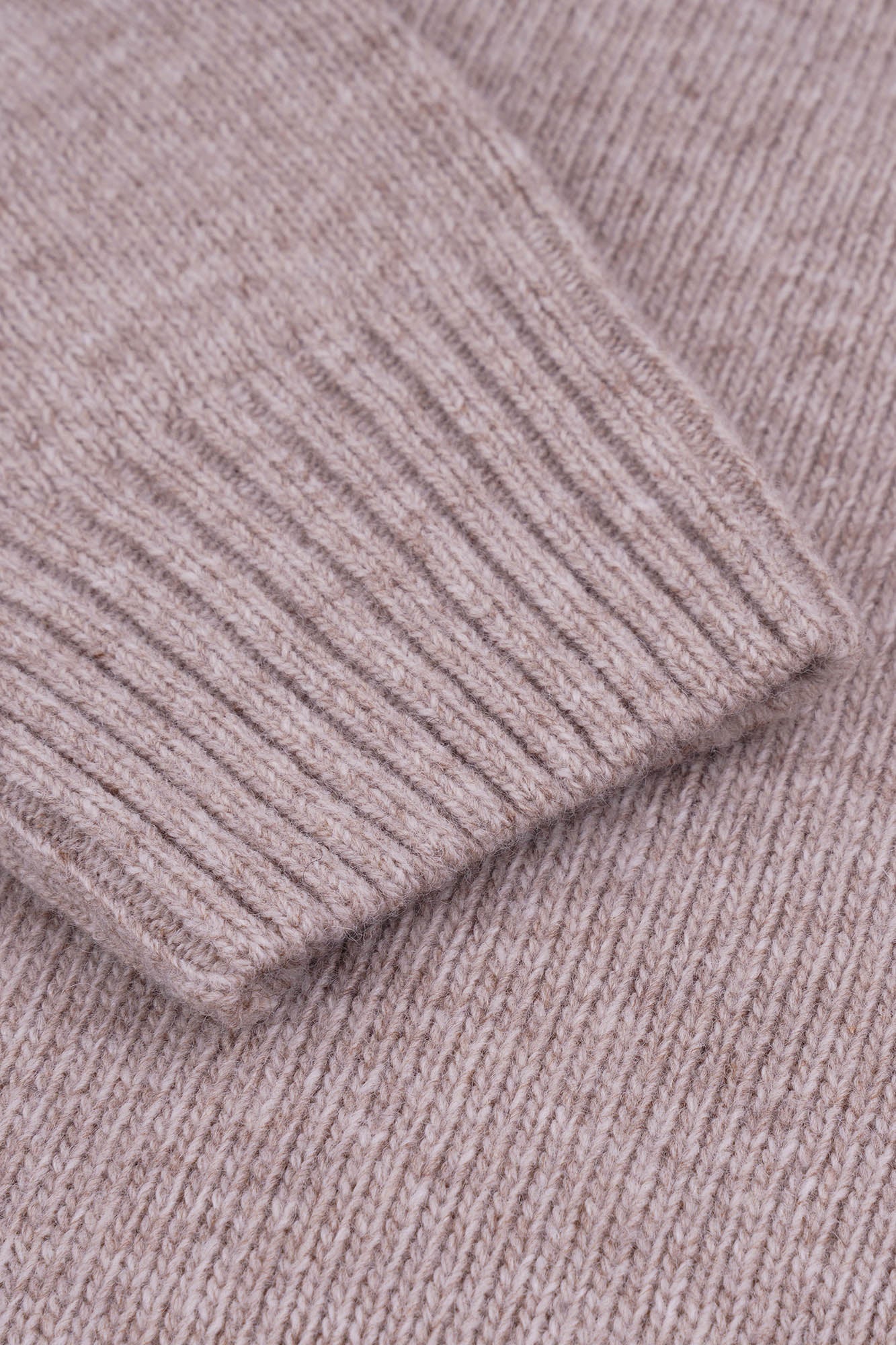 Image of Close-up of a ribbed knit fabric in a neutral color.