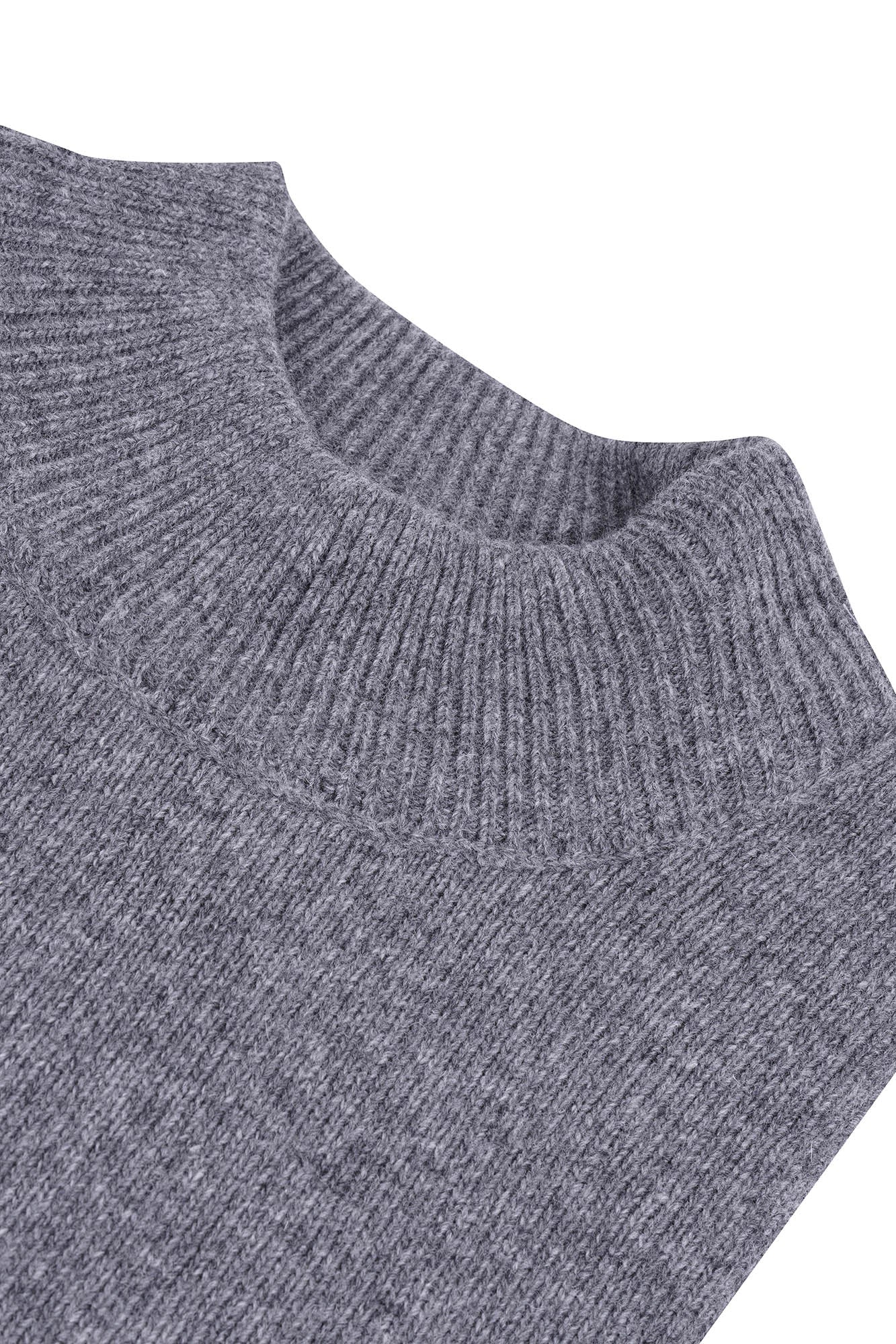 Image of Close-up of a gray sweater with a ribbed texture on a white background