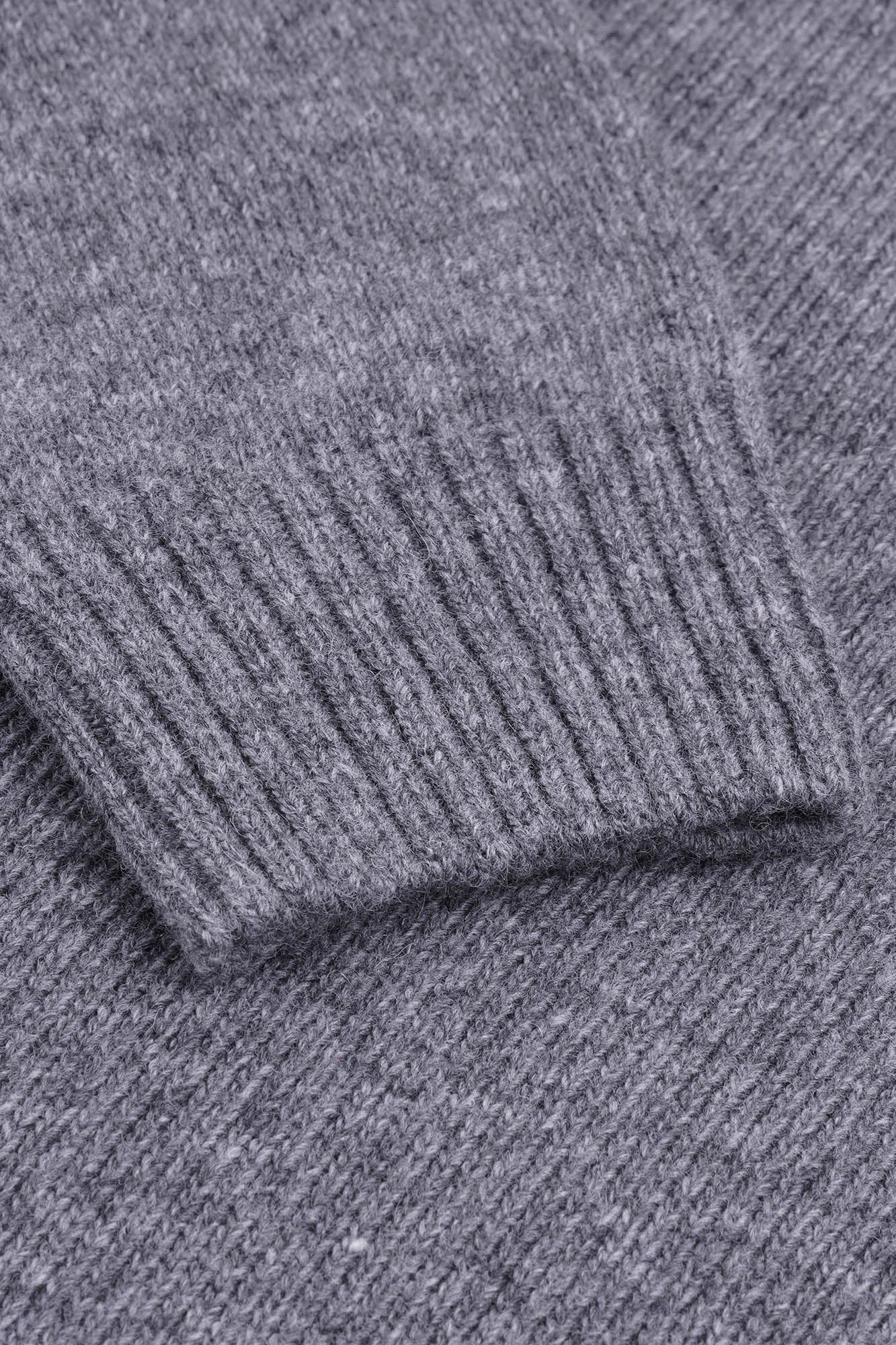 Image of Close-up of a textured gray fabric surface